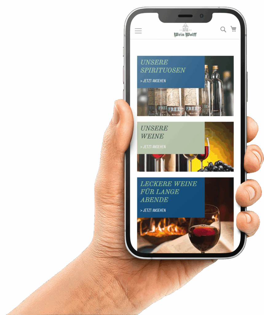 Eine Hand mit einem Smartphone auf dem die Startseite von Wein Wolff zu sehen ist